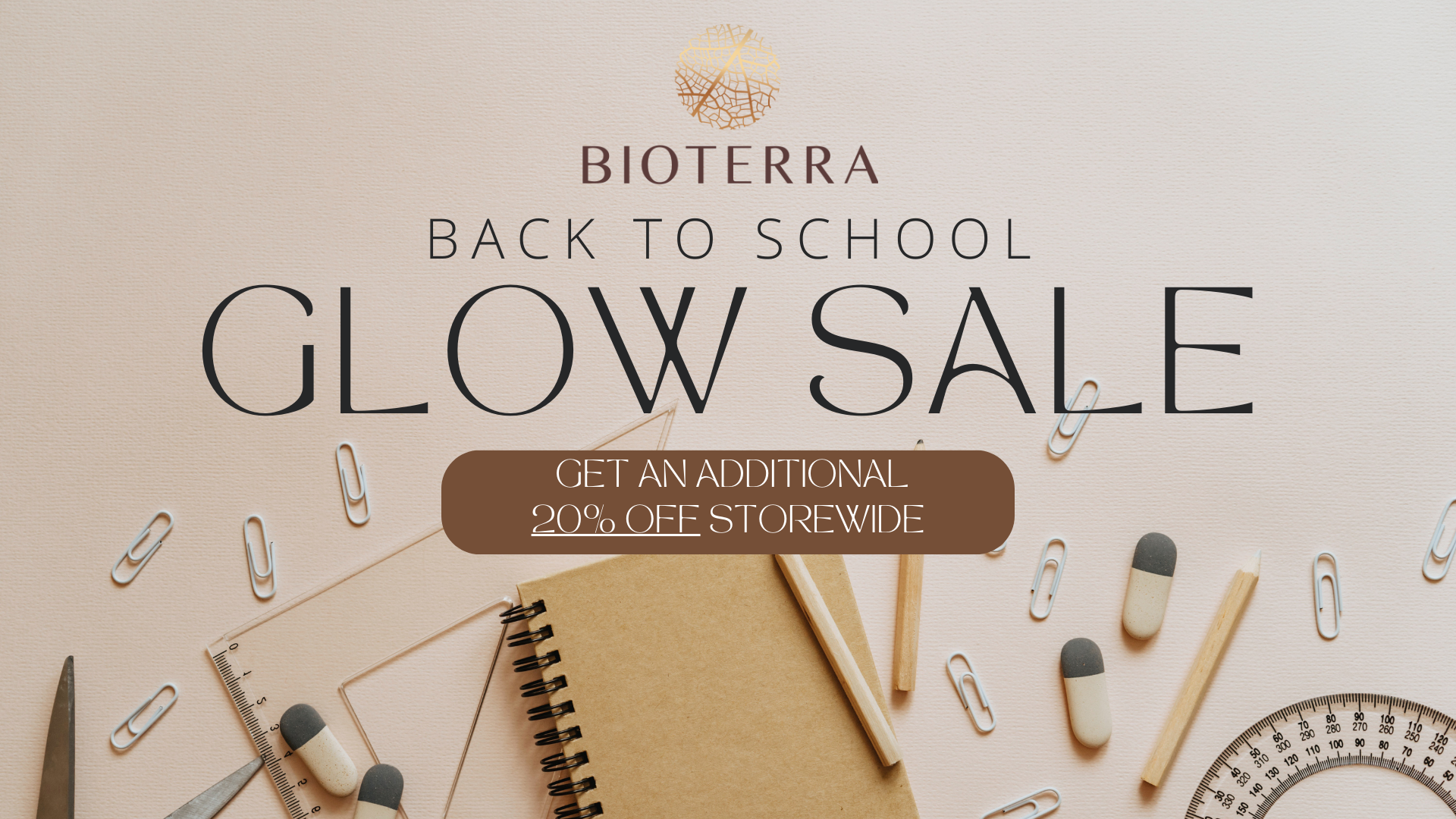 Promotional banner for Bioterra Back to School Glow Sale with stationery items on a light background.